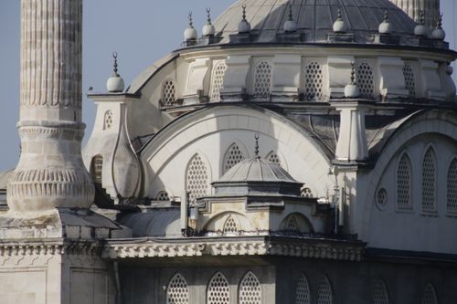 Free Detailed view of a mosque's dome and minaret, showcasing intricate architecture. Stock Photo