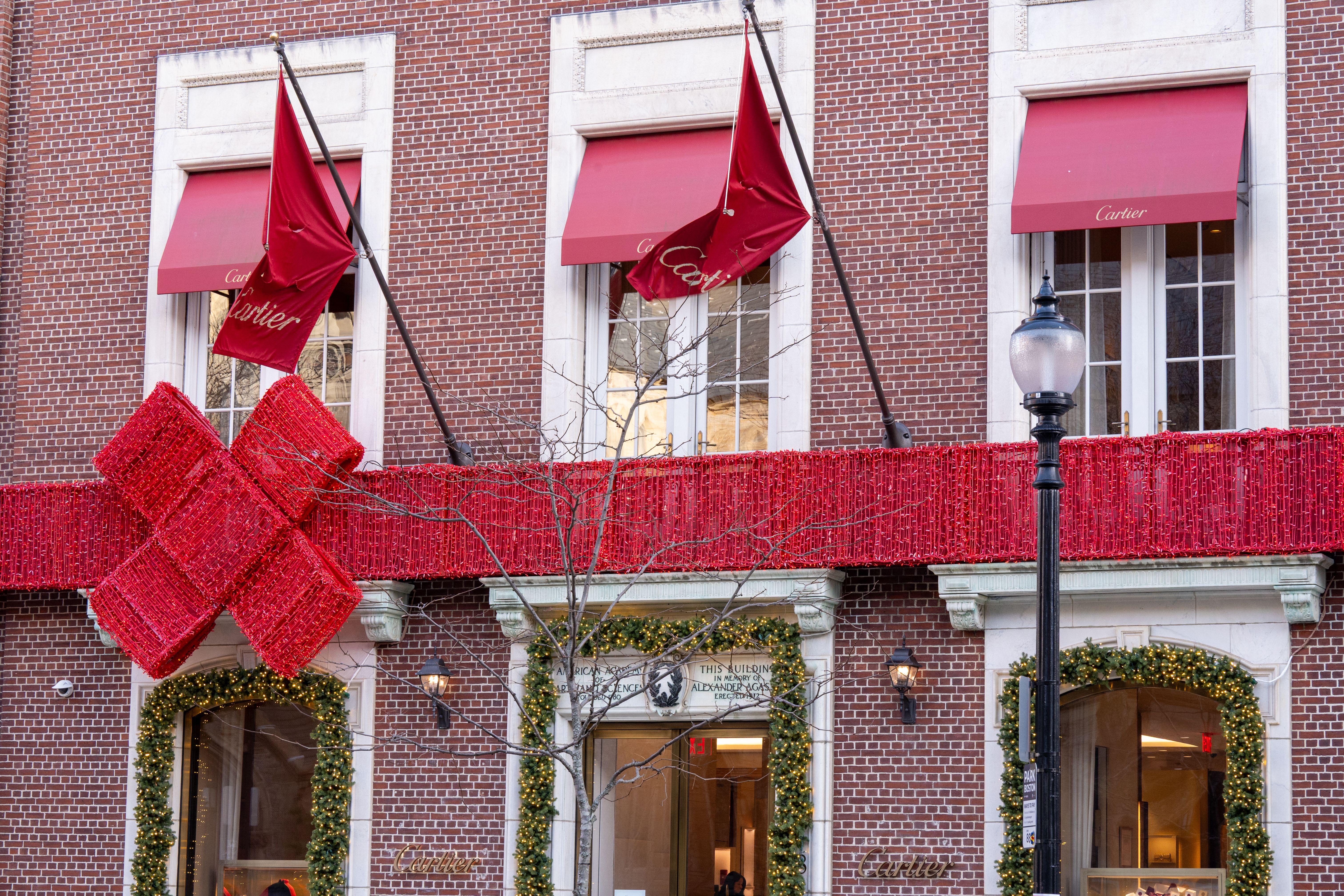 festive storefront in a local downtown neighborhood - seasonal marketing campaign ideas