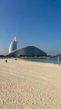 Stunning view of Burj Al Arab and Jumeirah Beach in Dubai on a sunny day.