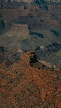 A stunning aerial view of the Grand Canyon's majestic and rugged terrain in Arizona, USA.