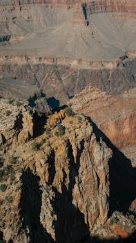 Breathtaking aerial view of Grand Canyon's rugged cliffs in Arizona.