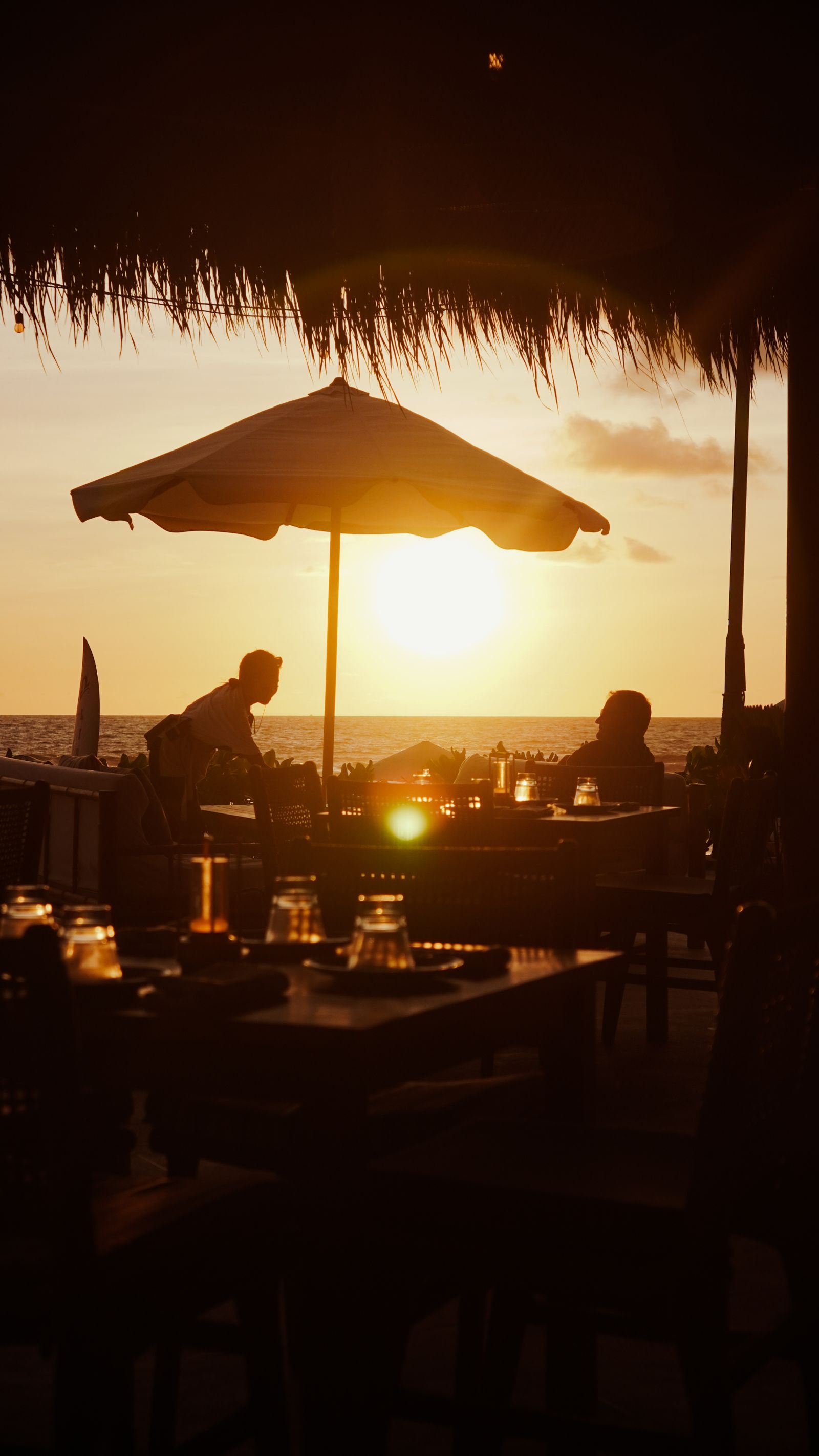 Restaurant table overlooking the water near sunset