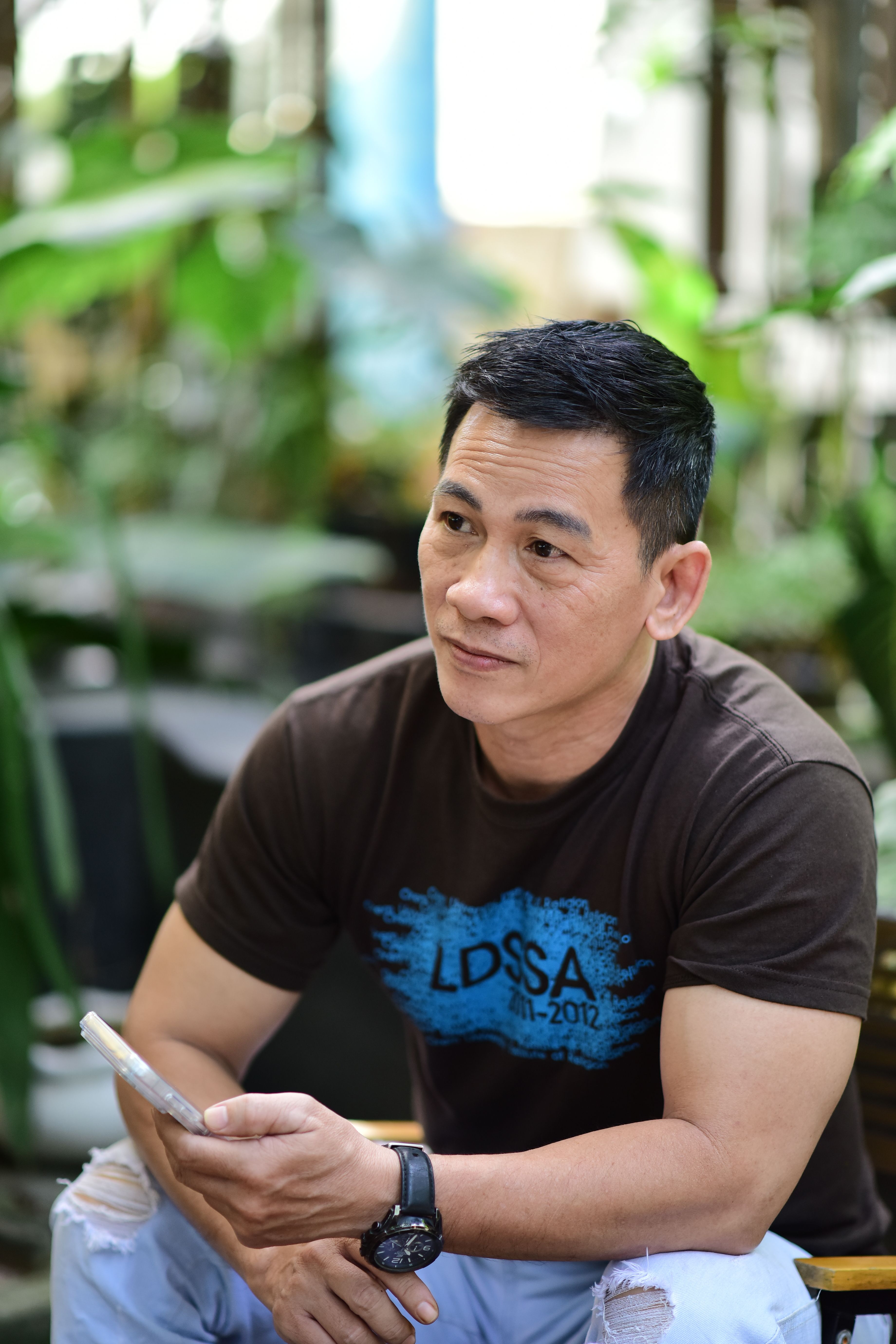 Casual Portrait of Man in Greenery Setting