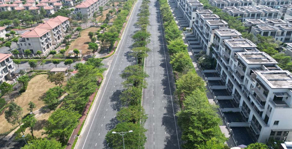 Aerial view of landed residential homes — subterranean termites move through the soil beneath them