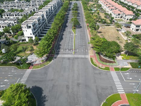 Aerial shot of a modern residential area with wide roads and lush greenery in Dong Nai, Vietnam.