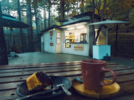 A cozy café kiosk nestled in a serene wooded area in Thimphu, Bhutan.