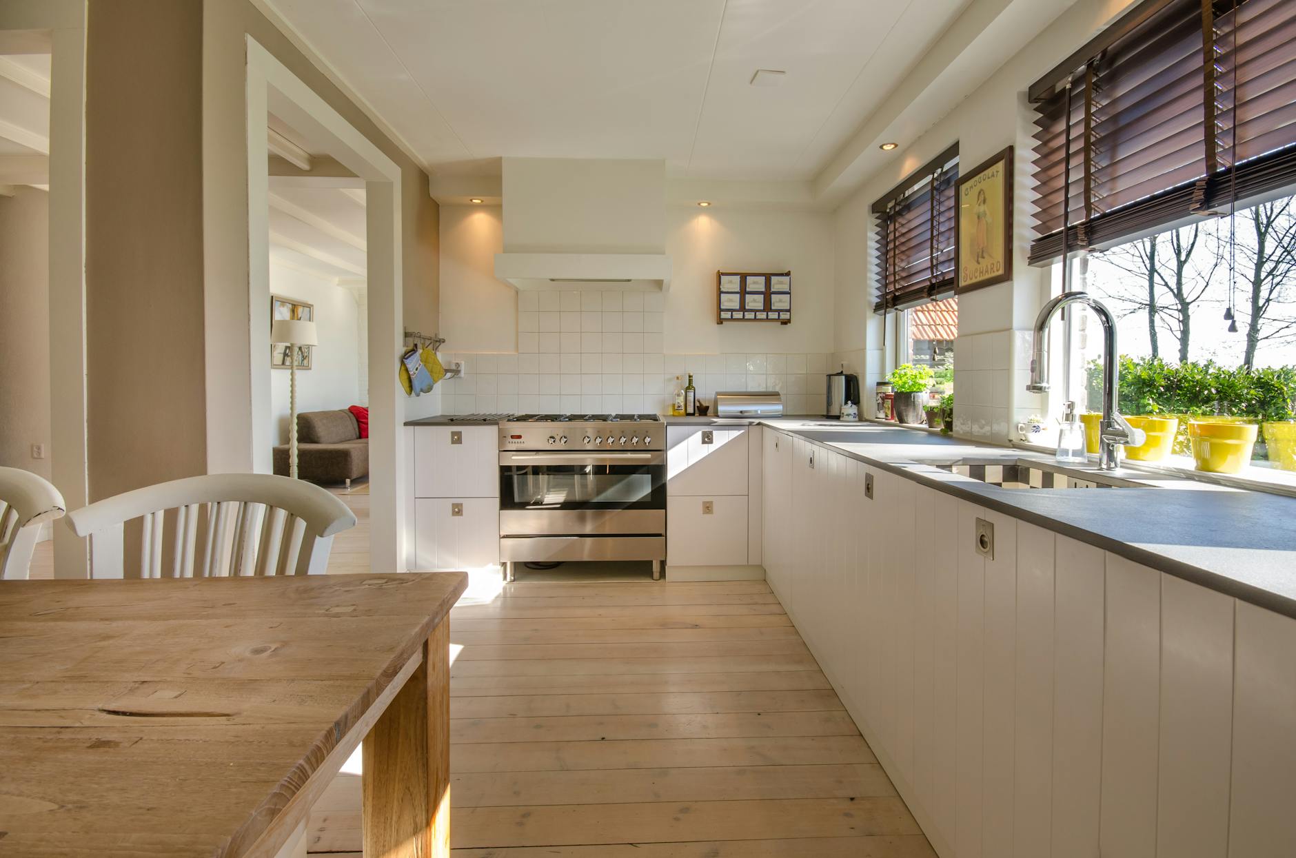 kitchen counter with chairs sink