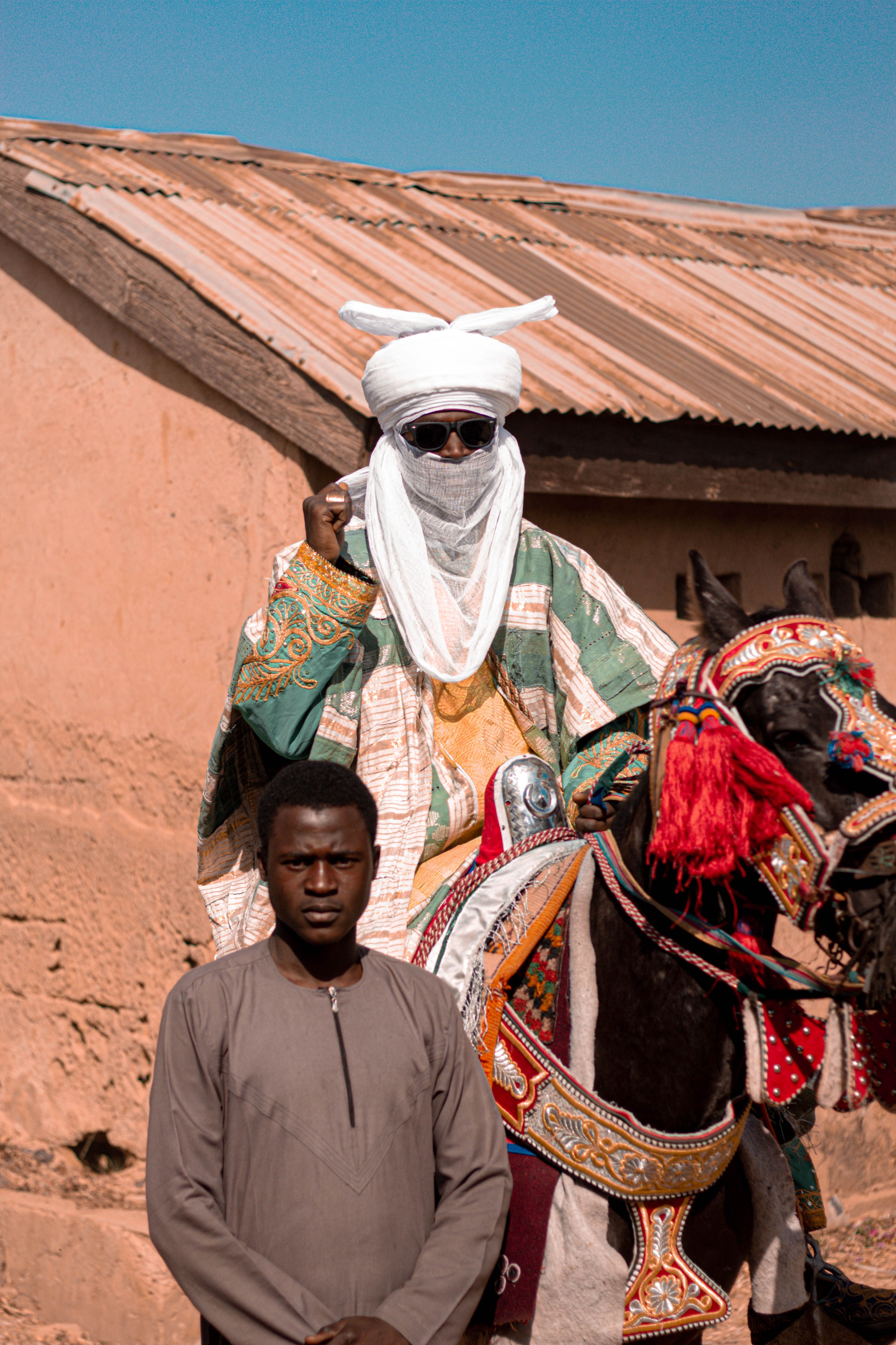 Traditional African Rider on Decorated Horse · Free Stock Photo