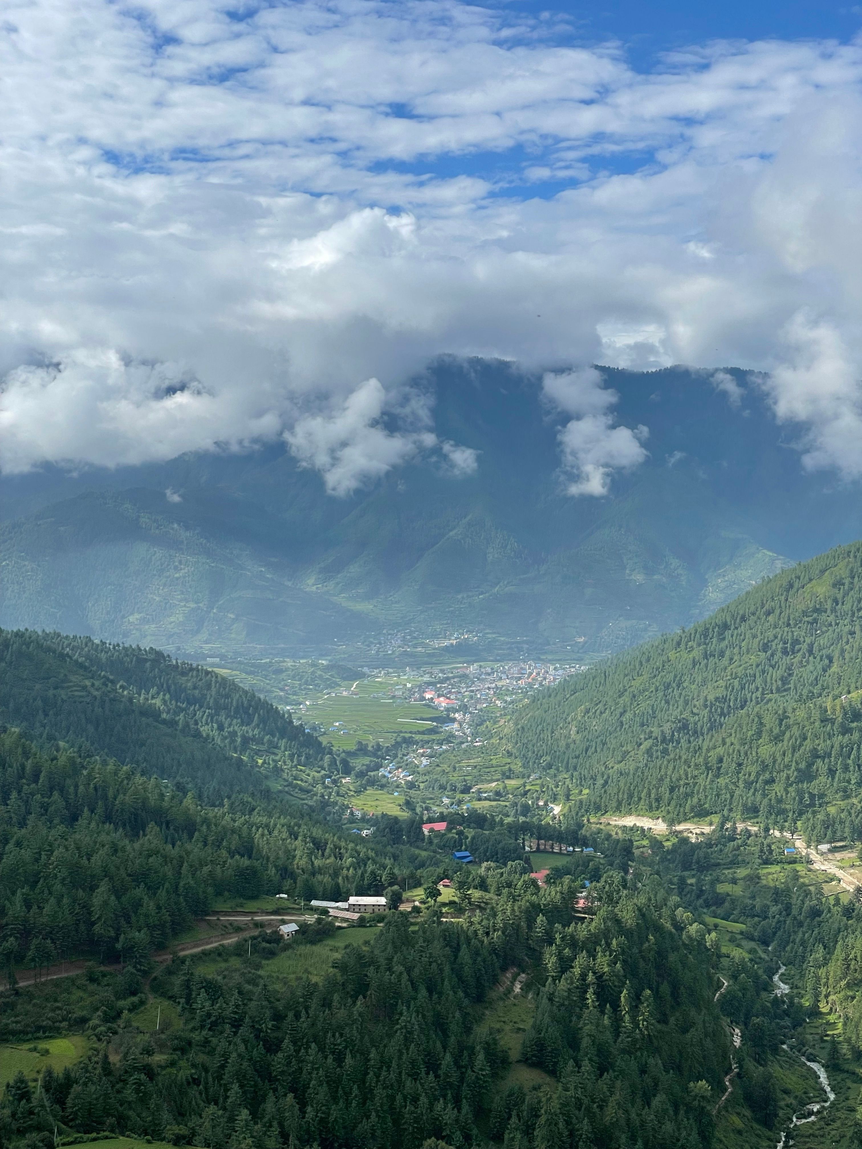 Aerial View of Lush Green Valley with Mountains · Free Stock Photo