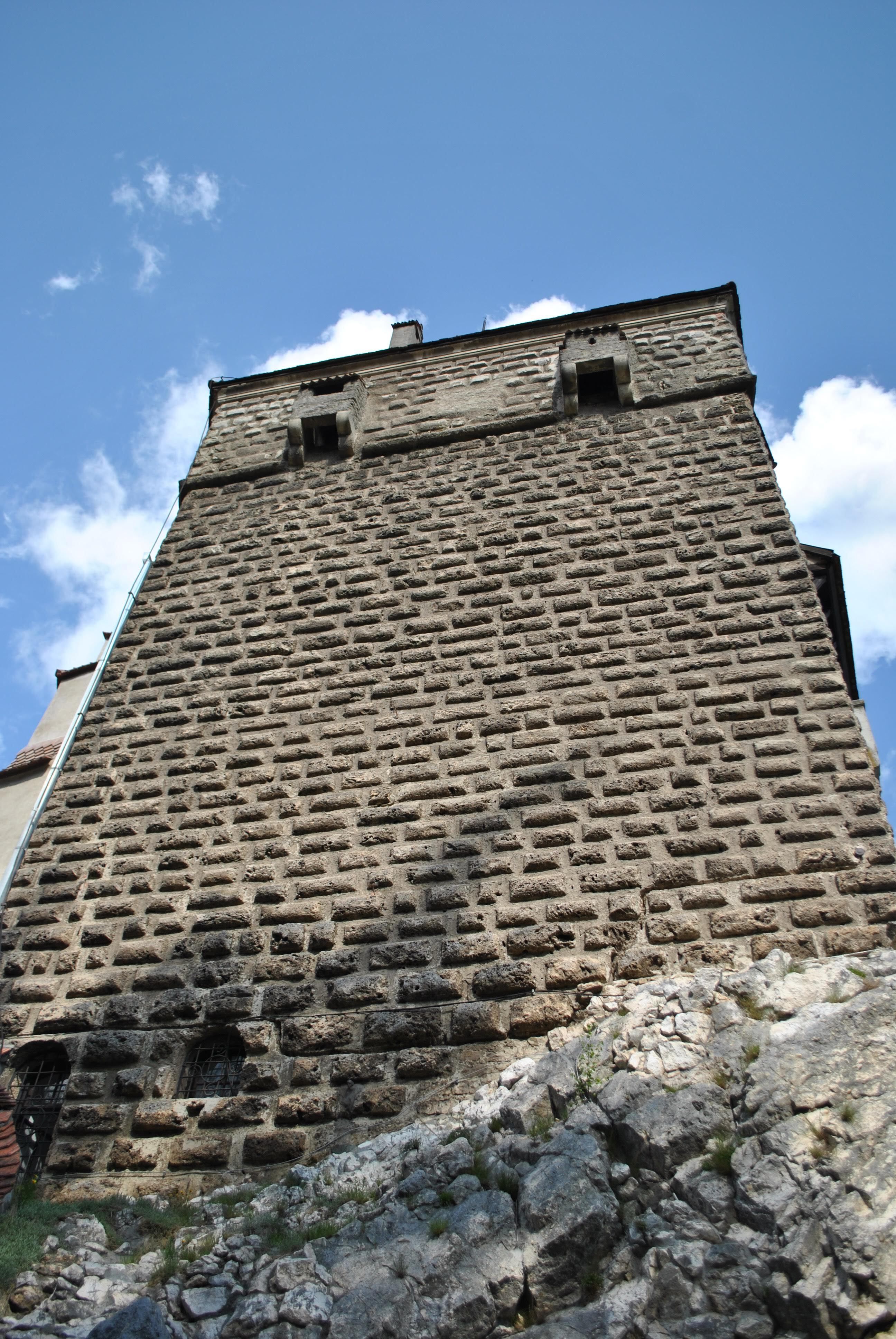 Historic Stone Tower Against Blue Sky · Free Stock Photo