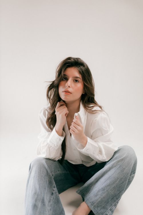 Casual Portrait of a Young Woman in White Shirt · Free Stock Photo