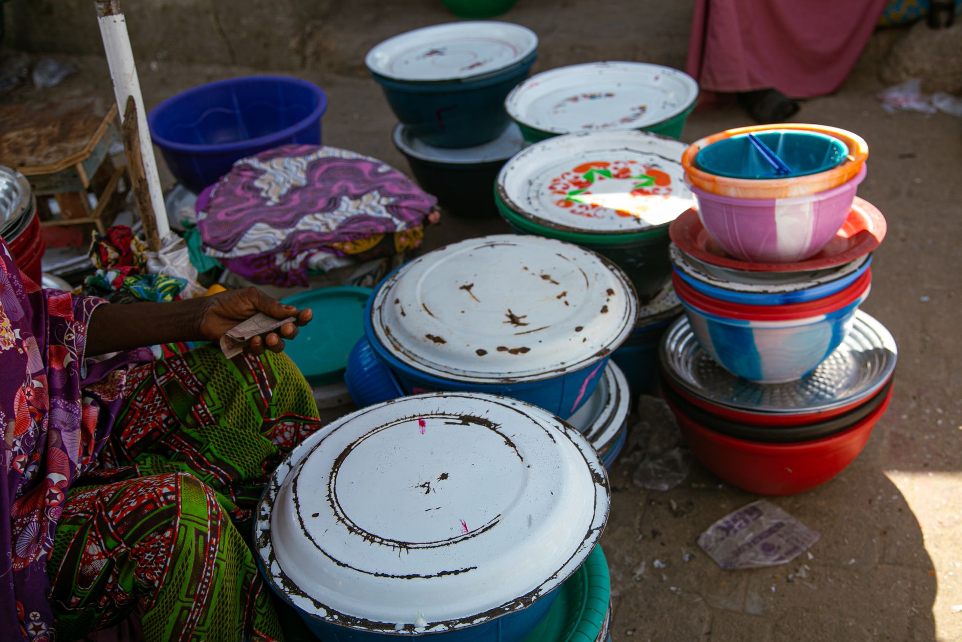 Vibrant array of stacked bowls in a street market in Maiduguri, Nigeria.