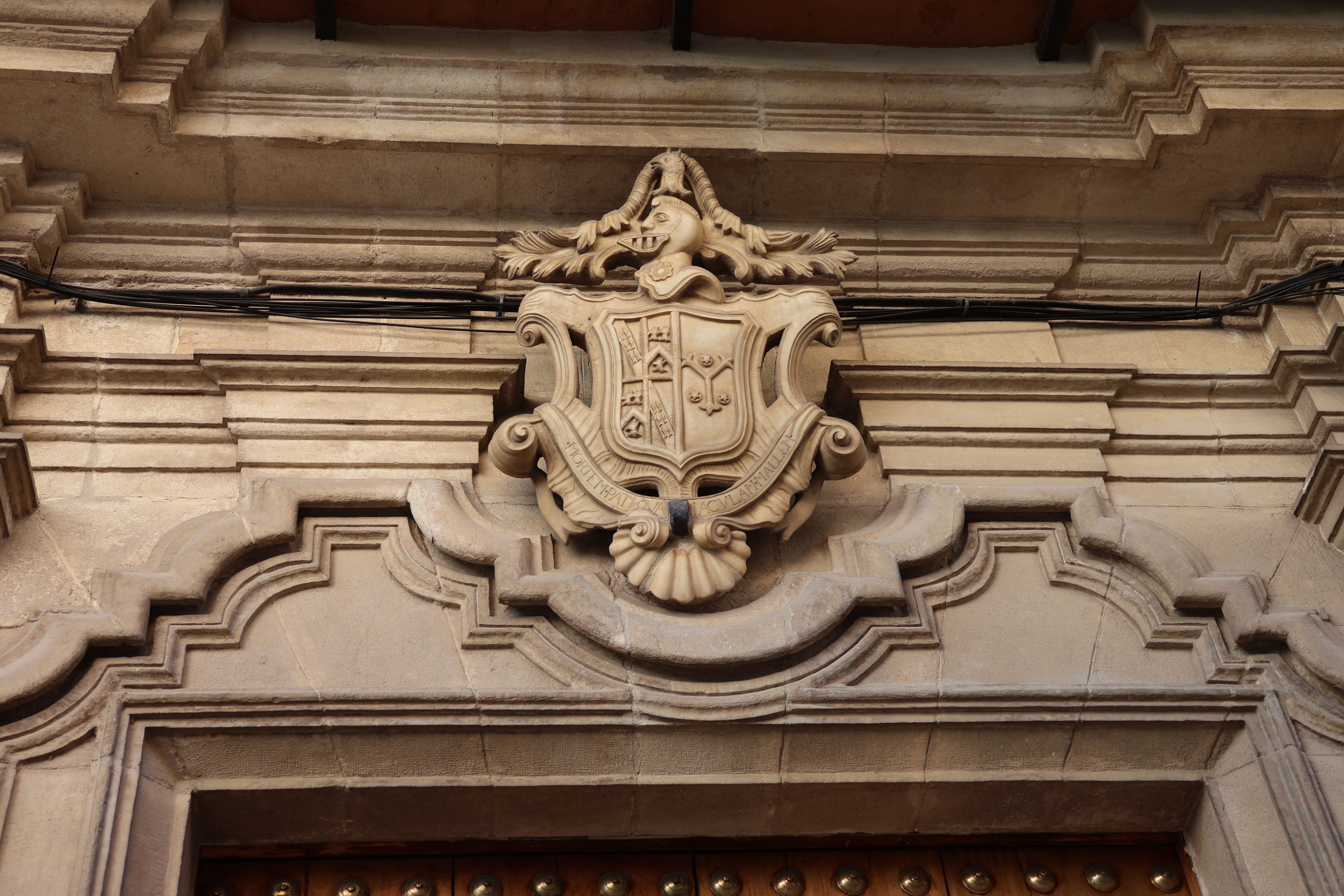 Historic Stone Crest on Andalusian Building Façade · Free Stock Photo
