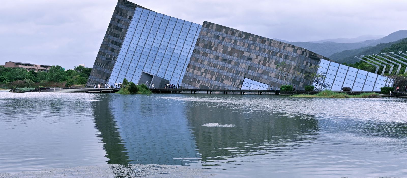 Explore the Lanyang Museum's unique tilted architecture in the scenic landscape of Yilan County, Taiwan.