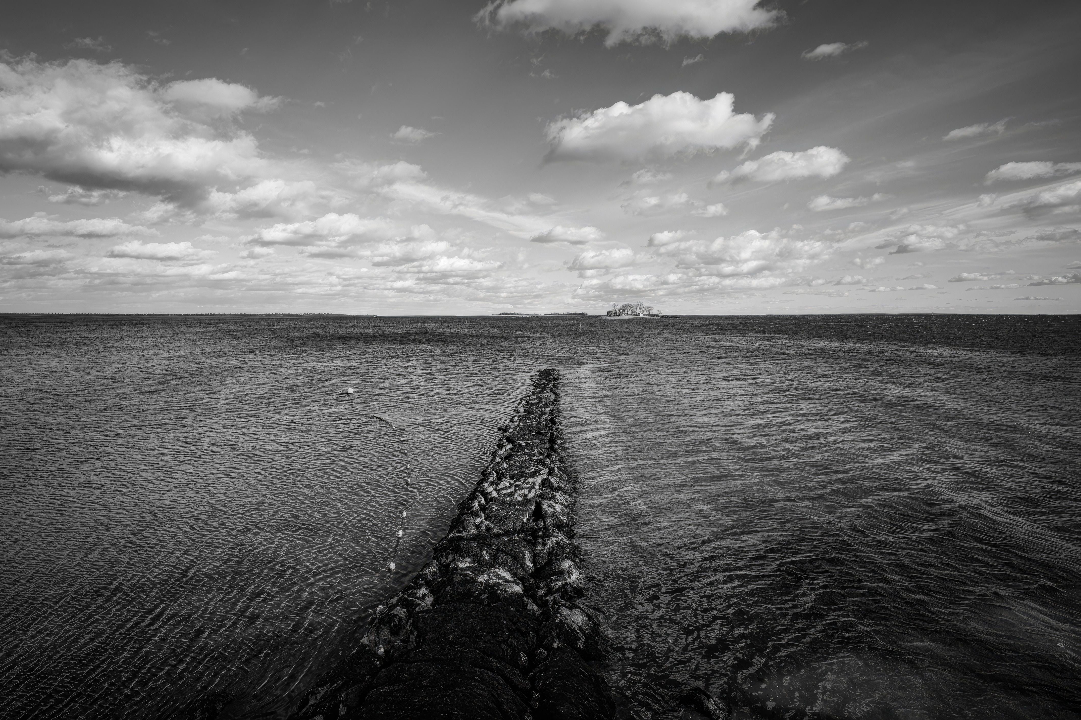 Black and White Seascape with Rocky Path · Free Stock Photo