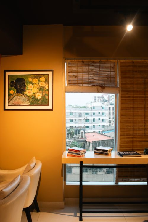 Free A serene indoor scene with a view of Dhaka city, featuring a warm interior setup. Stock Photo