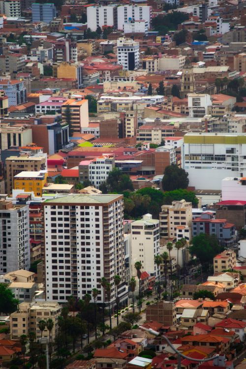Free A vibrant aerial view of Cochabamba cityscape featuring diverse architecture and lush greenery. Stock Photo