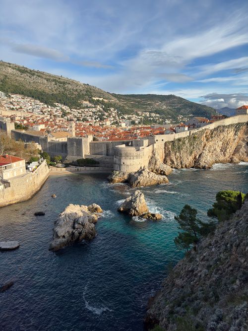 Free Stunning view of Dubrovnik's ancient city walls and Adriatic Sea under a clear sky. Stock Photo