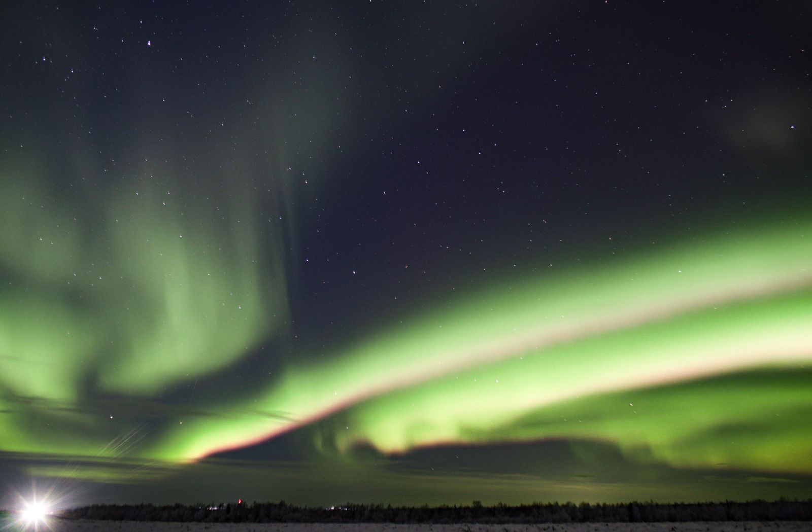 Aurora over the hills north of Whitehorse