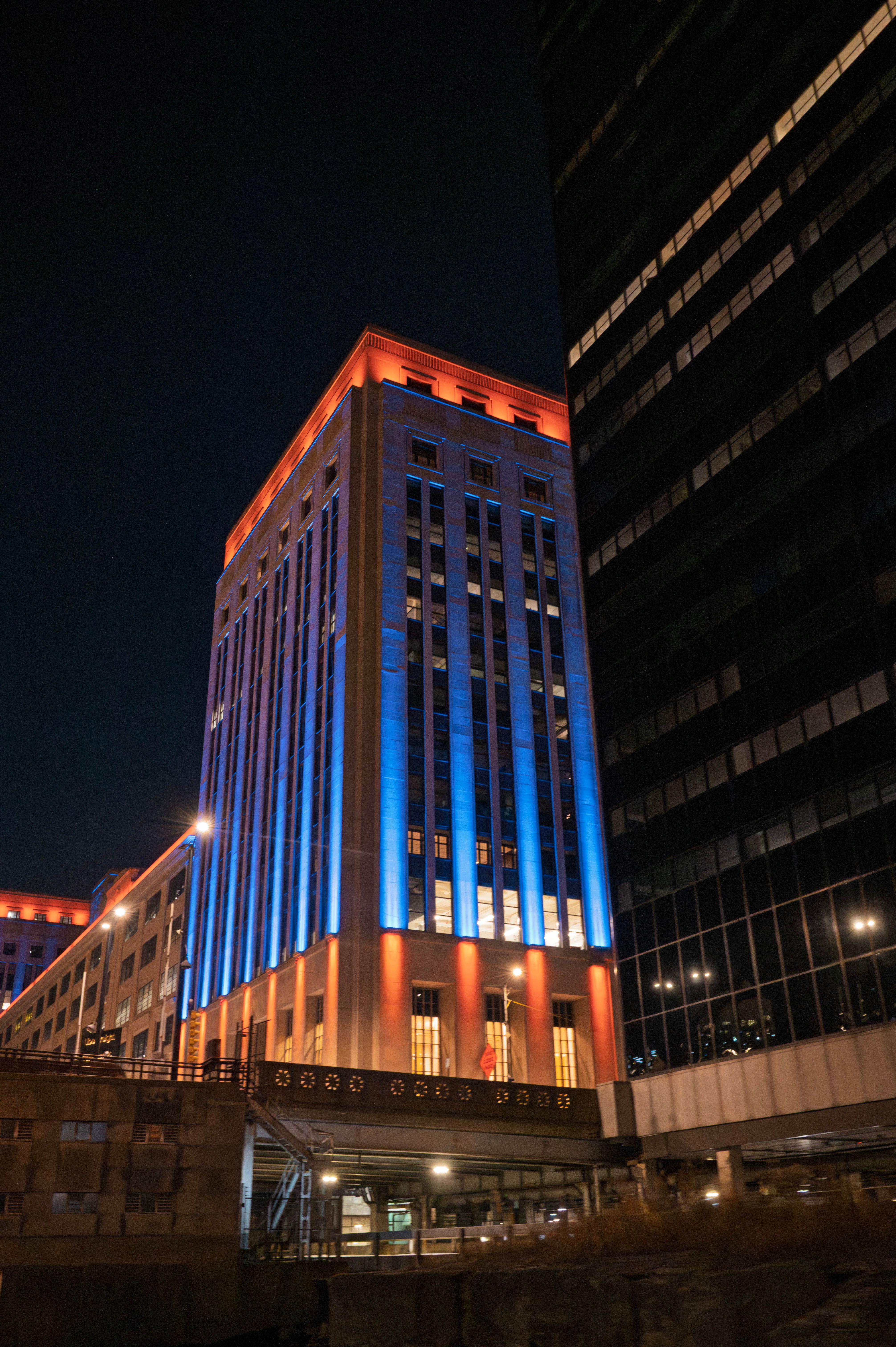 Illuminated Urban Building at Night with Vibrant Colors · Free Stock Photo