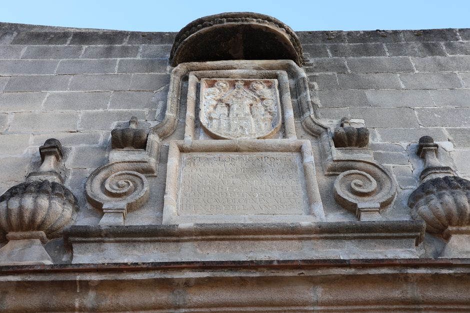 Close-up of a historical stone facade in El Puerto de Santa María, Spain.