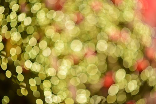 Free Captivating bokeh effect featuring vibrant festive lights, perfect for holiday and celebration themes. Stock Photo