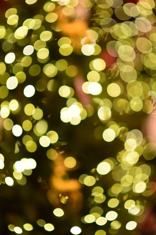 Free Abstract golden bokeh light background, perfect for festive and holiday designs. Stock Photo