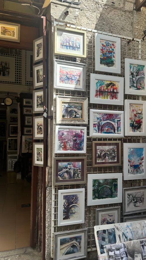 Free A vibrant art gallery entrance showcasing various framed artworks in Mostar. Stock Photo