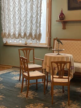 Elegant vintage room with a bird decor on table; perfect for classic decor themes.