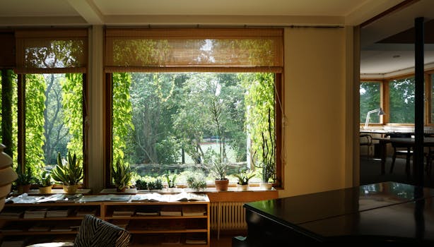 Sunlit home interior featuring potted plants and a serene garden view through large windows.