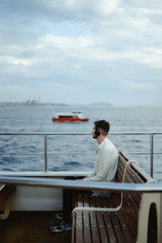 Man with headphones enjoying ferry ride on the Bosphorus, Istanbul.