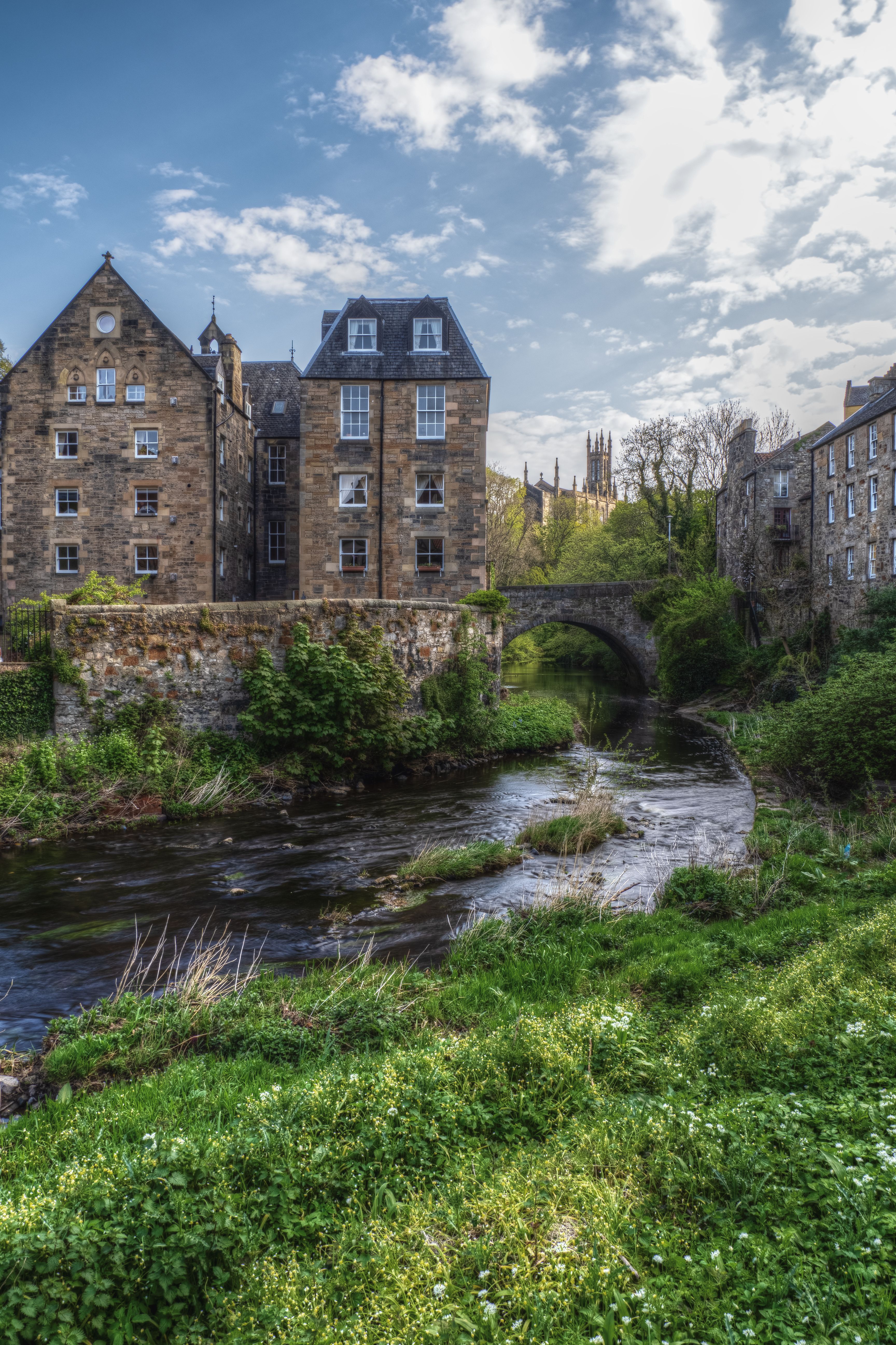 Charming Historic Buildings by a Scenic River · Free Stock Photo