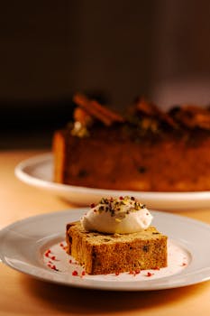 A mouth-watering slice of gourmet cake topped with cream served at a café in Tokyo, Japan.