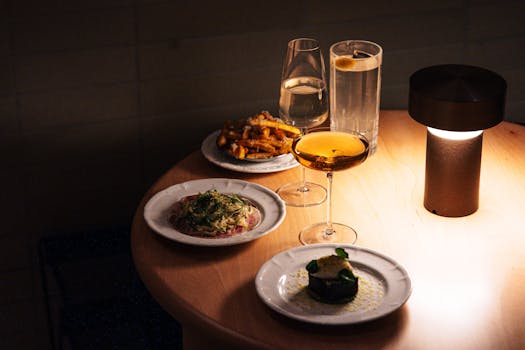 Sophisticated dining setup with gourmet dishes and drinks in Tokyo restaurant.