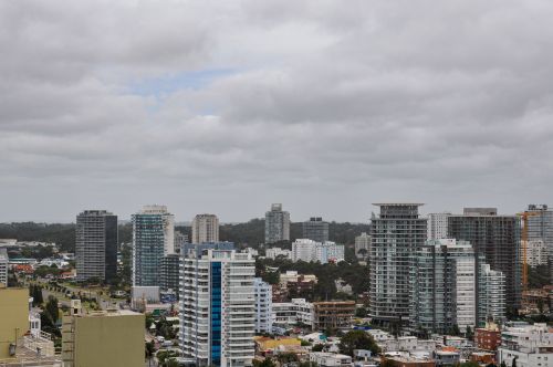 Free A broad view of the modern skyline in Punta del Este, Uruguay, under cloudy skies. Stock Photo
