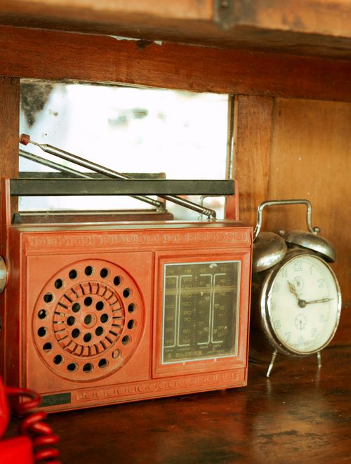 Free Retro radio and clock on a wooden shelf in São Paulo, Brazil. Stock Photo