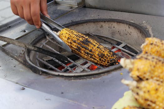 Close-up of grilled corn being roasted at a street market in Istanbul, Turkey.