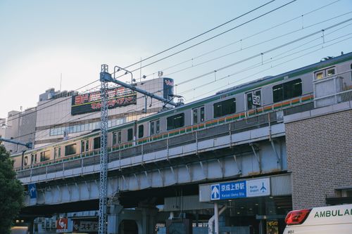Free Train on elevated tracks near Keisei Ueno station in Tokyo, Japan during daytime. Stock Photo