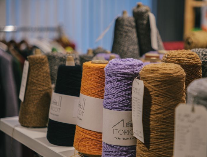 Yarn spools stacked on a table