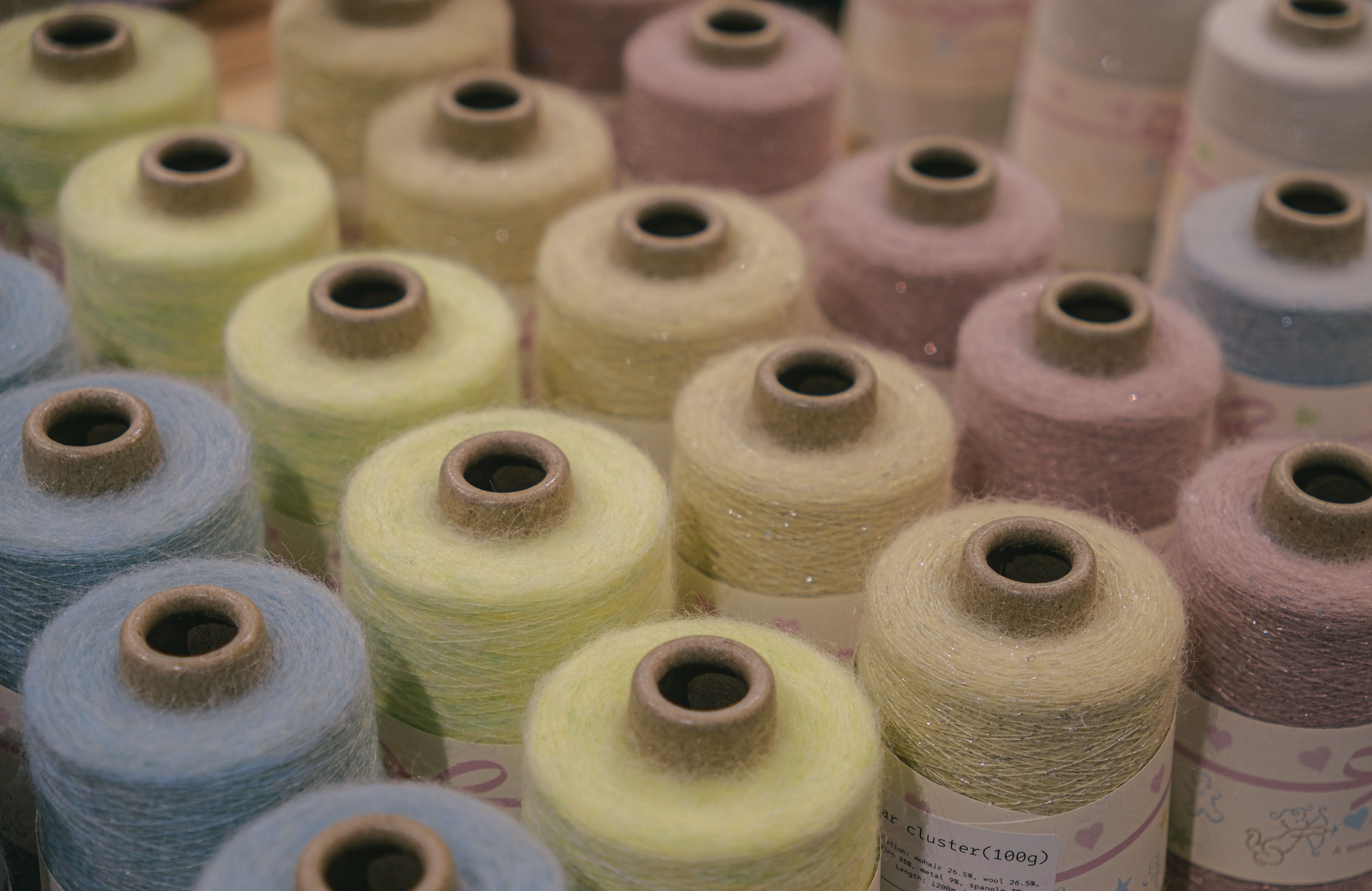 Yarn; (not sewing thread), of acrylic or modacrylic staple fibres, mixed mainly or solely with cotton, not put up for retail sale