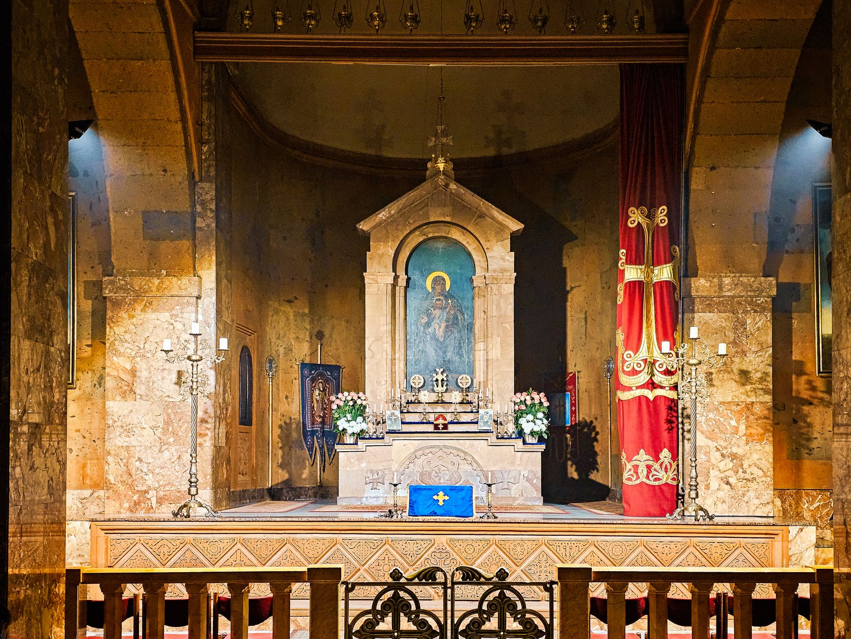 Intricate church altar with religious icons and ornate decorations.