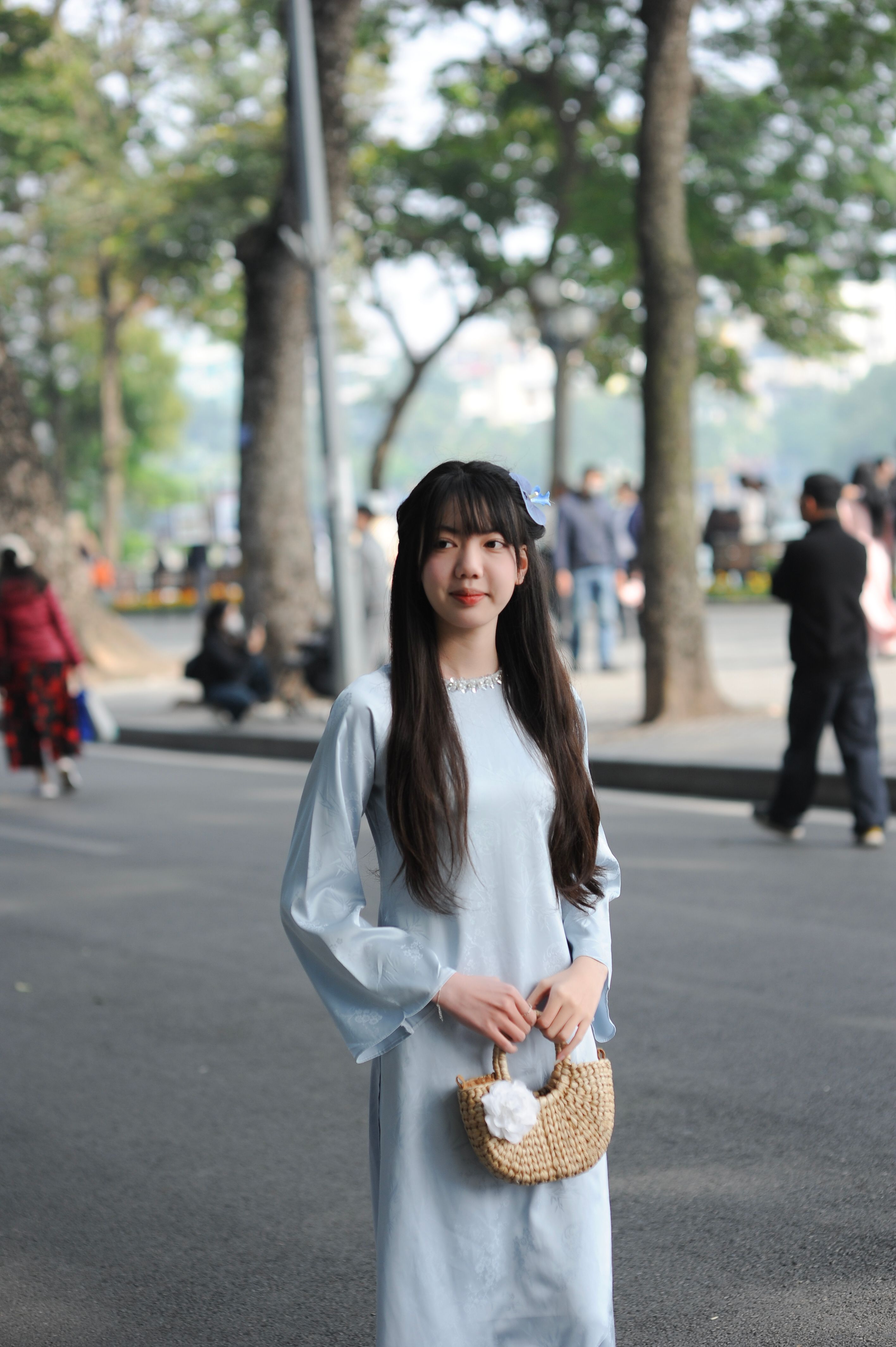 Young Woman Posing on City Street in Blue Dress · Free Stock Photo