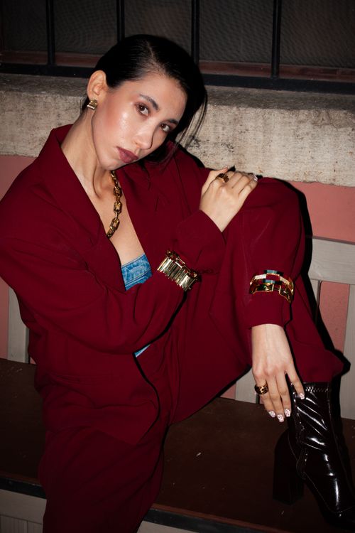 Free Stylish woman in a burgundy outfit showcasing modern urban fashion. Stock Photo