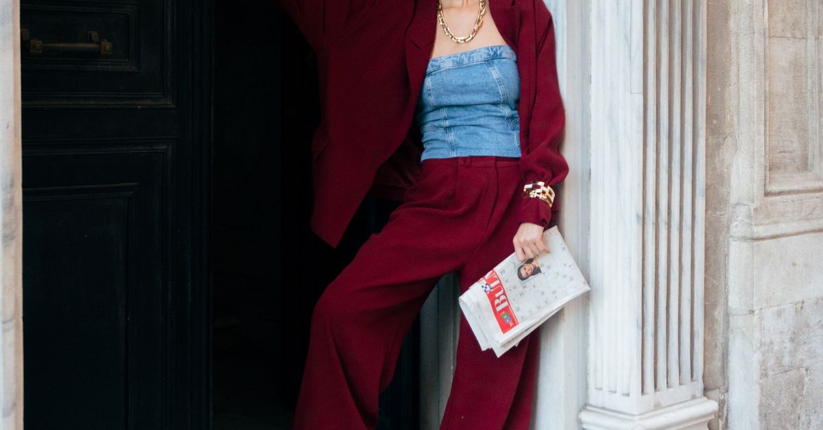 Woman wearing burgundy tailored suit