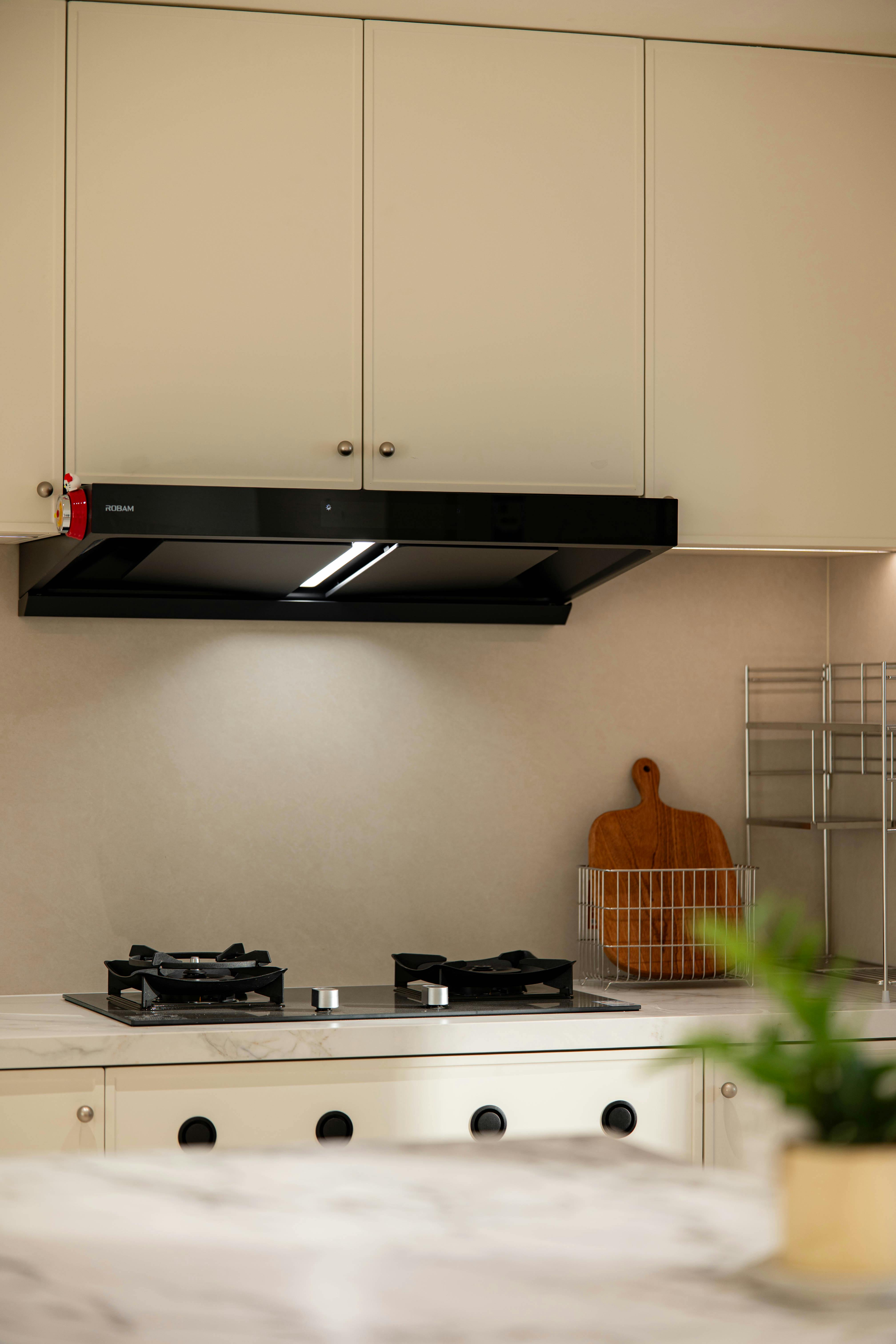 Sleek kitchen interior featuring a gas stove and modern cabinets.
