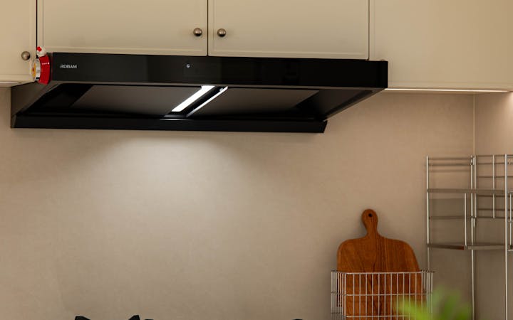 Sleek kitchen interior featuring a gas stove and modern cabinets.