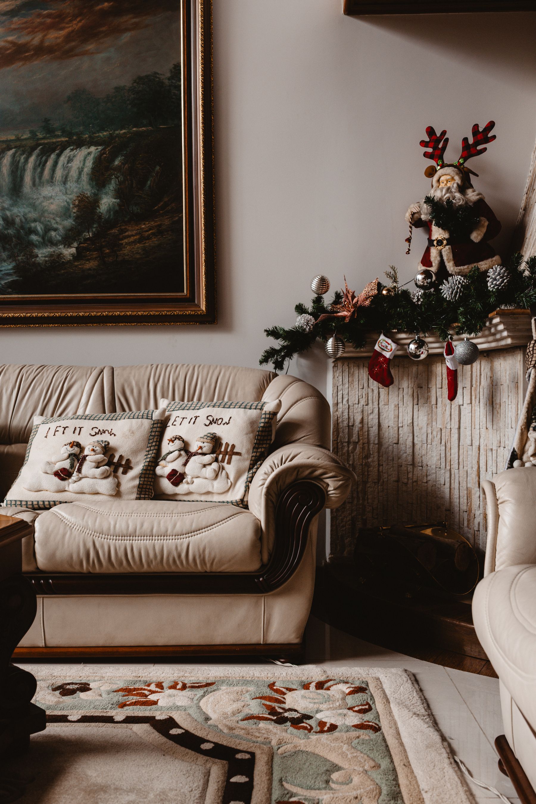 Cozy seating area with Christmas pillows warm textiles and festive decor