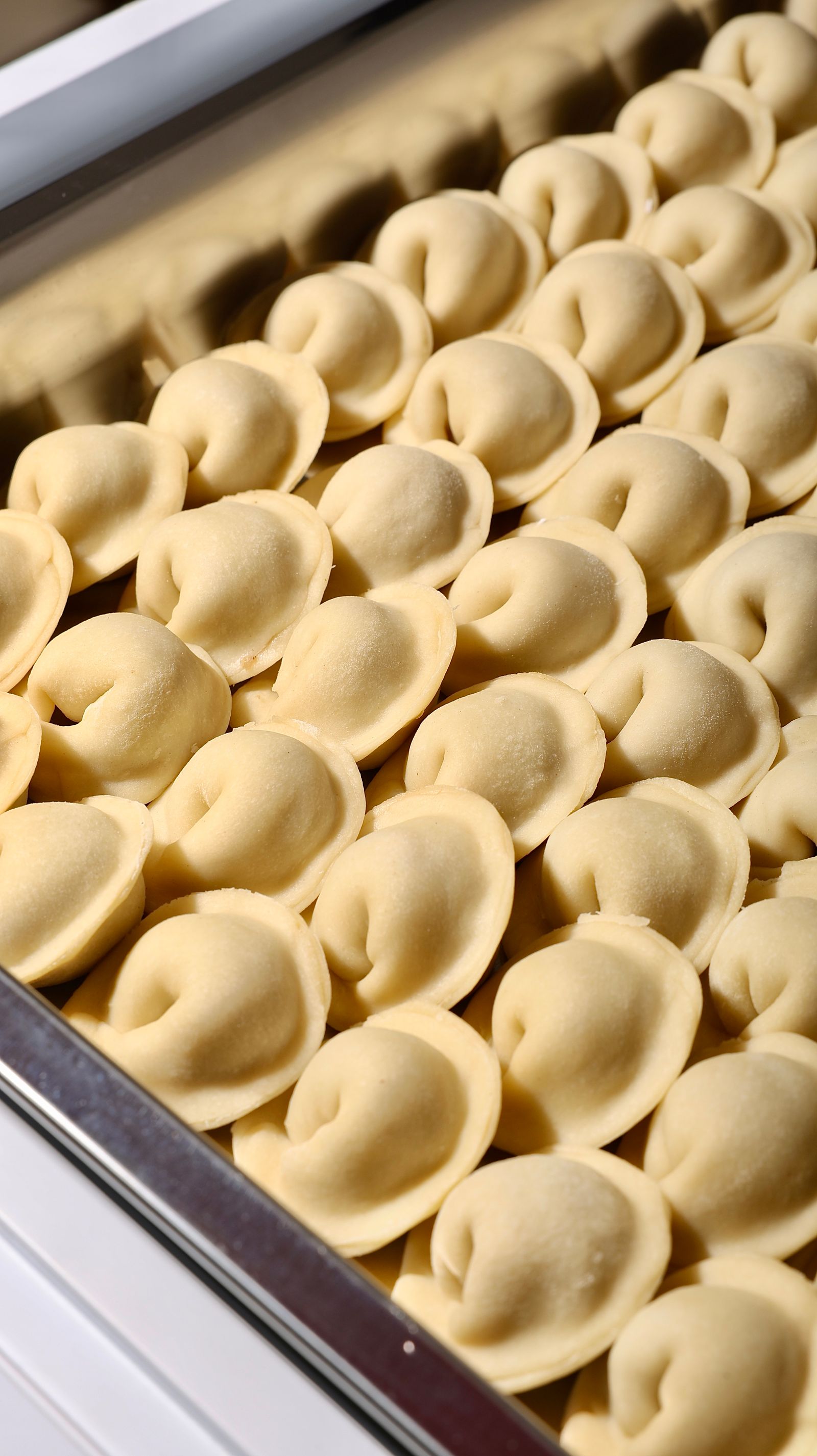 Frozen prepared food arranged in a metal container