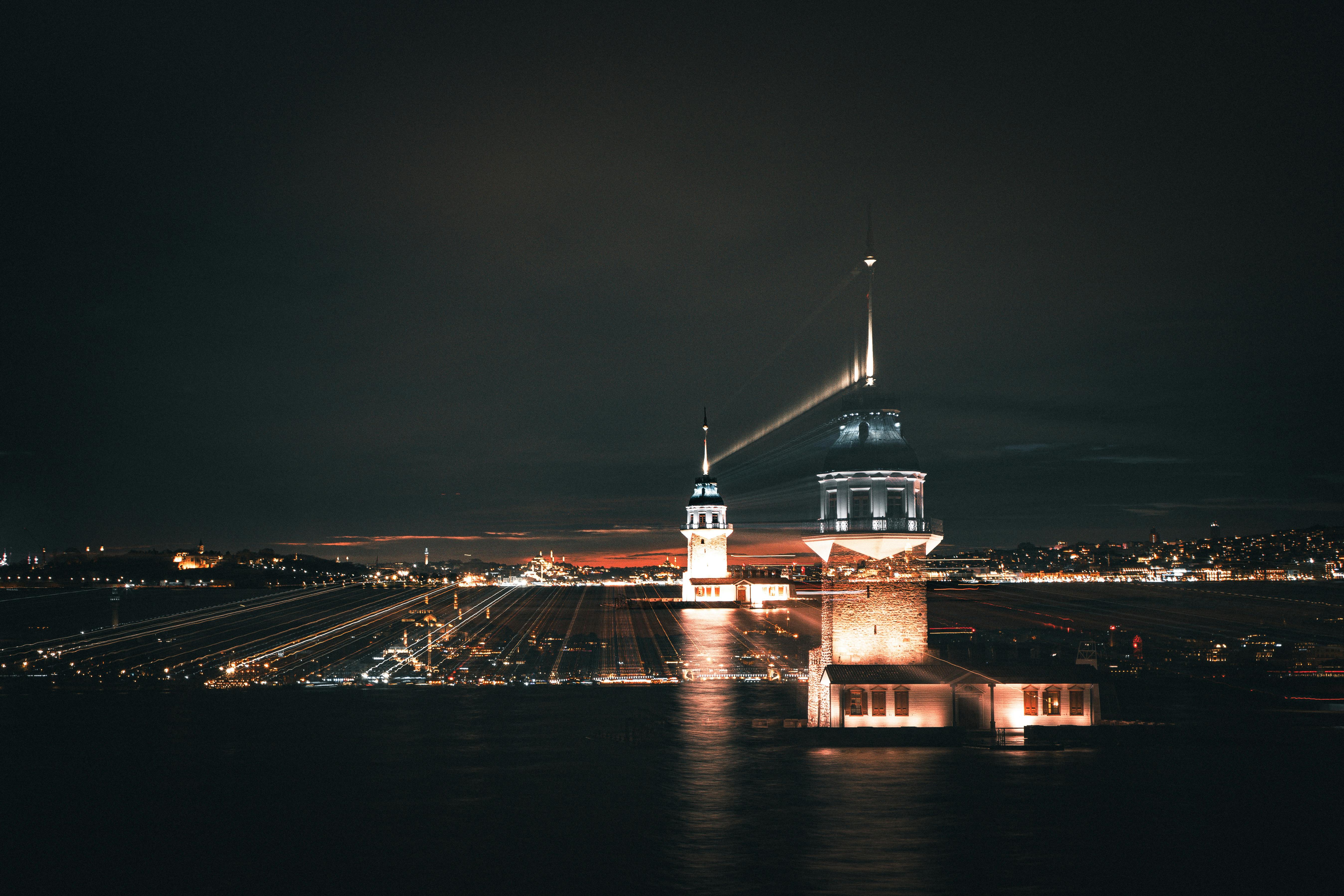 A mesmerizing long exposure of the iconic Maiden's Tower illuminated at night in Istanbul, Turkey.