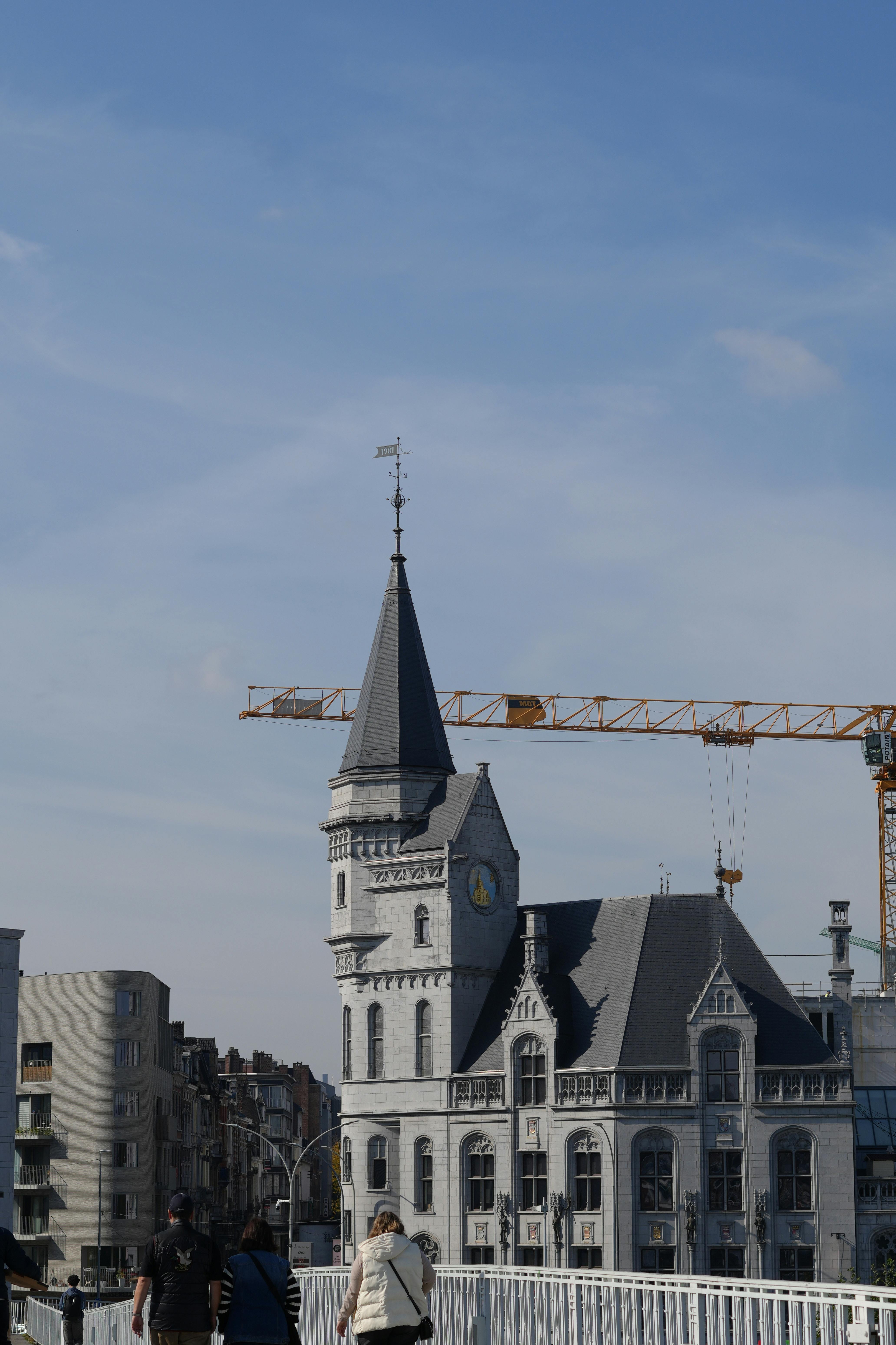 Construction crane over a new residential high-rise in Liège, Belgium